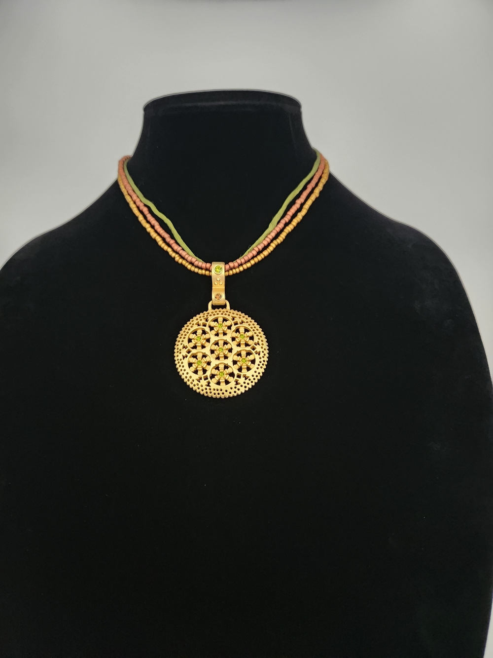 Gold Tone Filigree Pendant Necklace with Green Accents